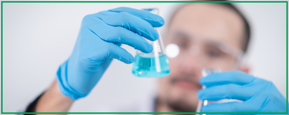 Image of a scientist with beakers